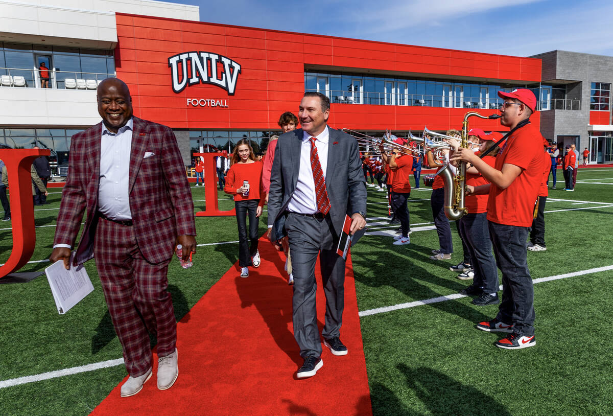 UNLV athletic director Erick Harper, left, arrives with Dan Mullen and his family as they intro ...