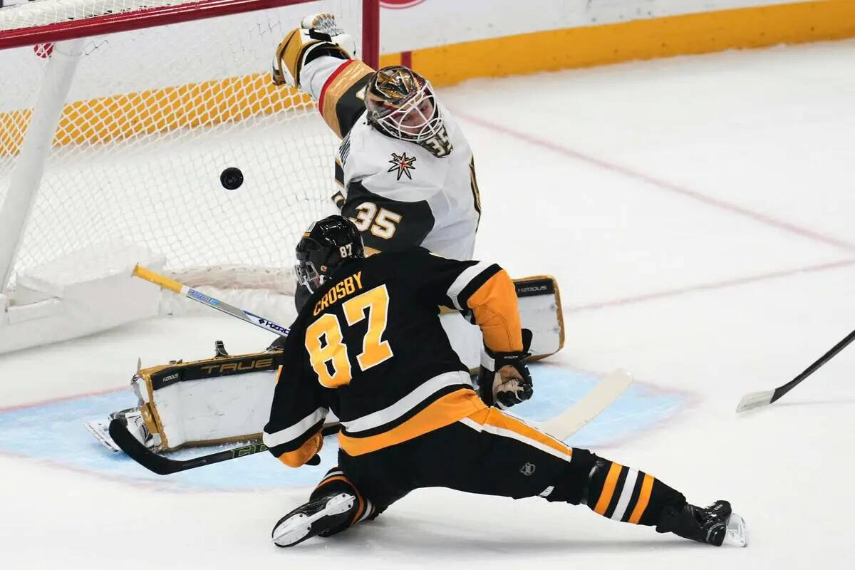 Pittsburgh Penguins' Sidney Crosby (87) gets a shot behind Vegas Golden Knights goaltender Ilya ...