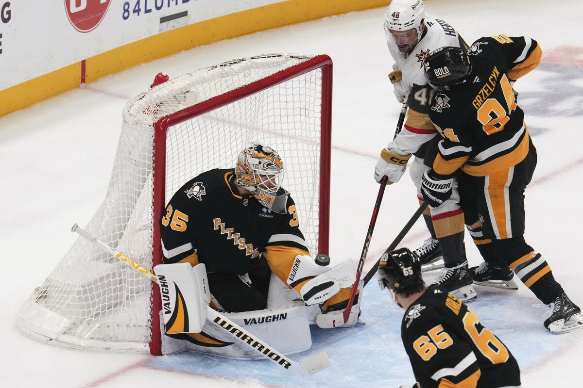 Pittsburgh Penguins goaltender Tristan Jarry (35) blocks a shot by Vegas Golden Knights' Tomas ...