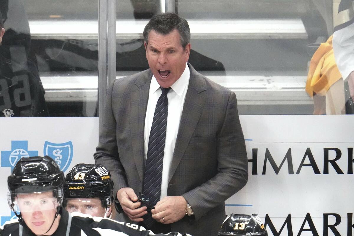 Pittsburgh Penguins head coach Mike Sullivan stands behind his bench during the third period of ...