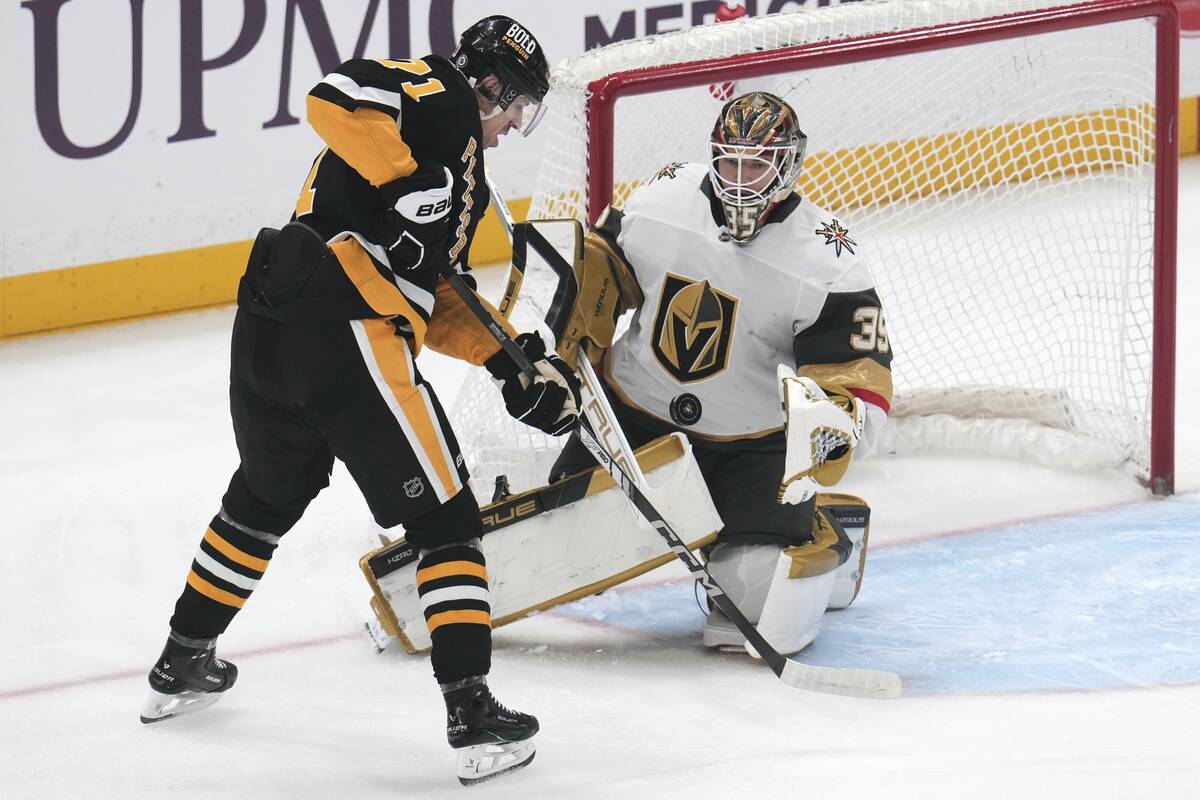 Pittsburgh Penguins' Evgeni Malkin (71) has a shot blocked by Vegas Golden Knights goaltender I ...