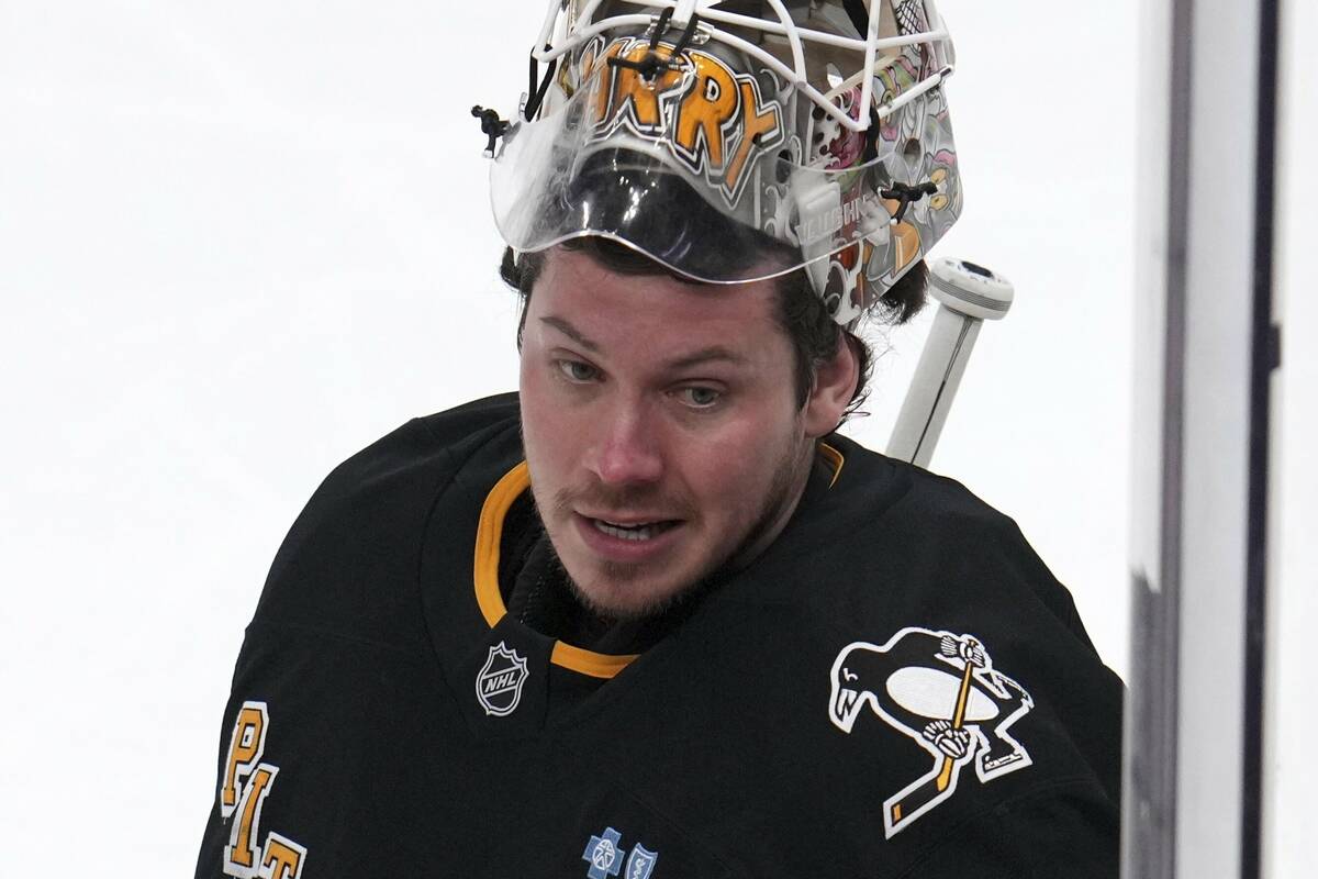 Pittsburgh Penguins goaltender Tristan Jarry takes a timeout during the first period of an NHL ...