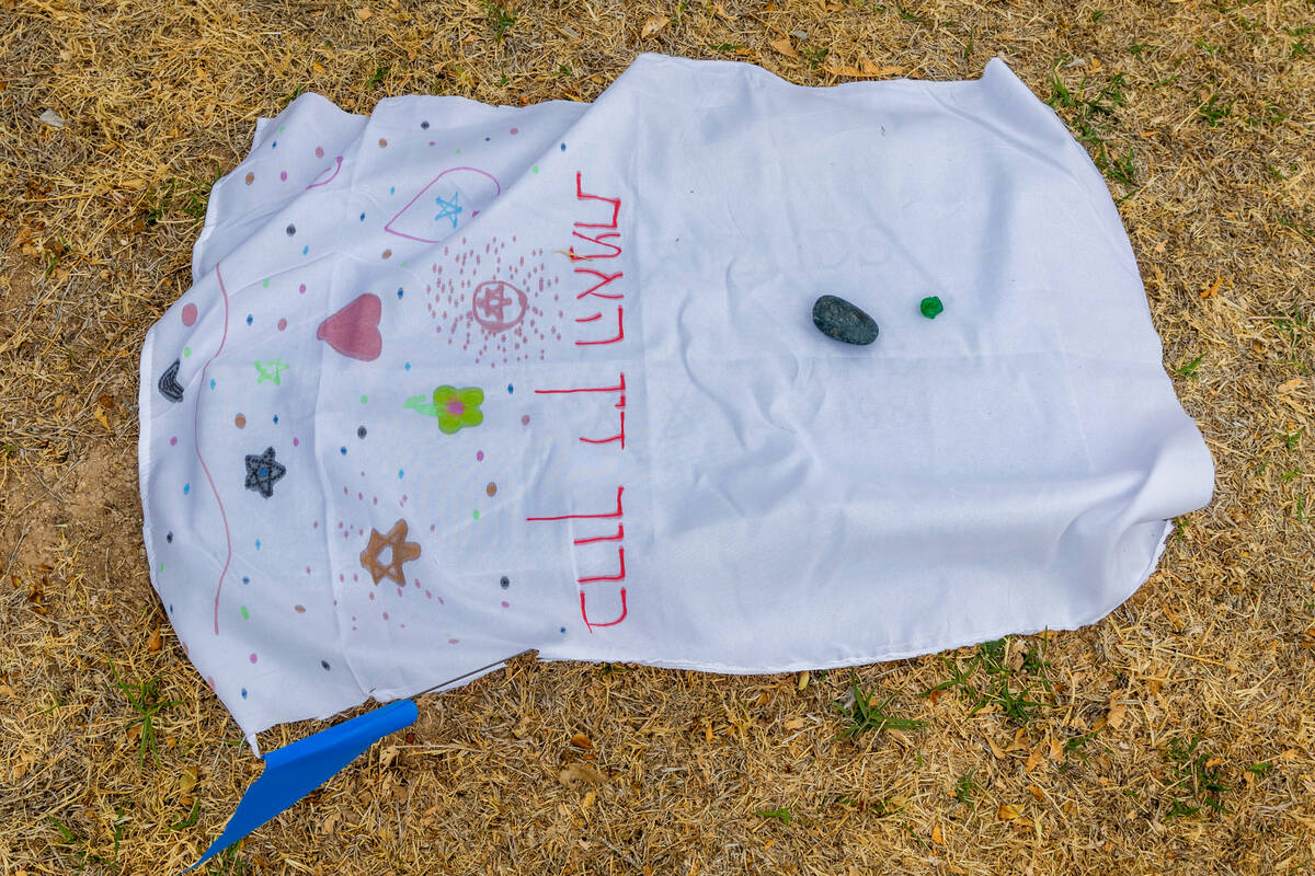 One of the covers designed by children with stones atop a flat grave marker as the local Jewish ...