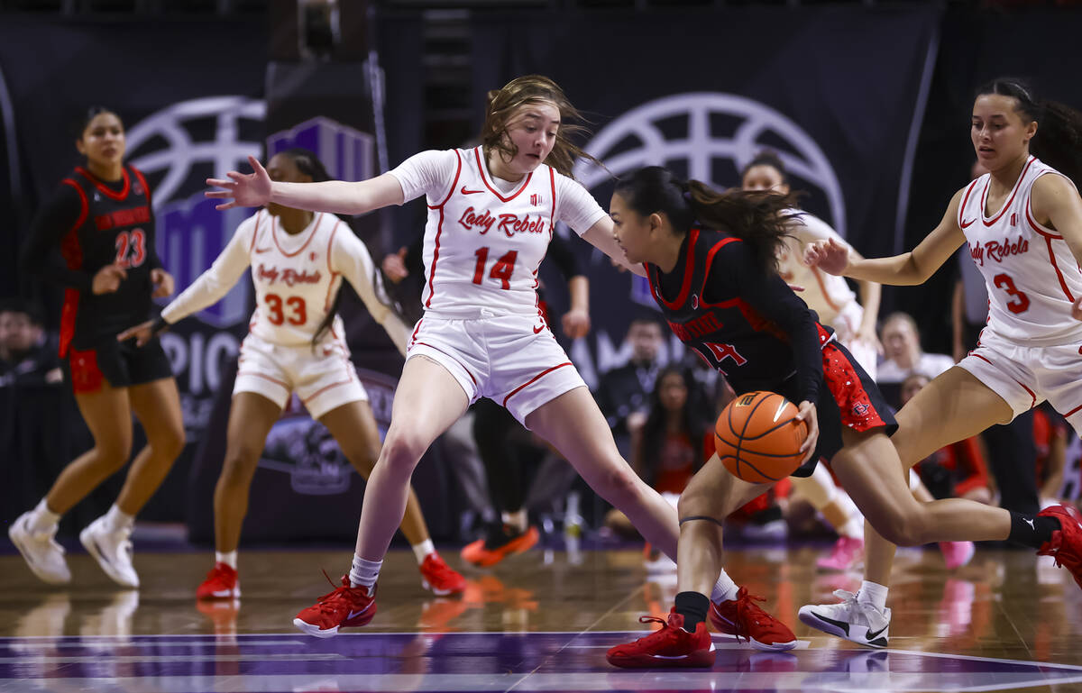 San Diego State Aztecs guard Naomi Panganiban (24) drives the ball against UNLV Lady Rebels gua ...
