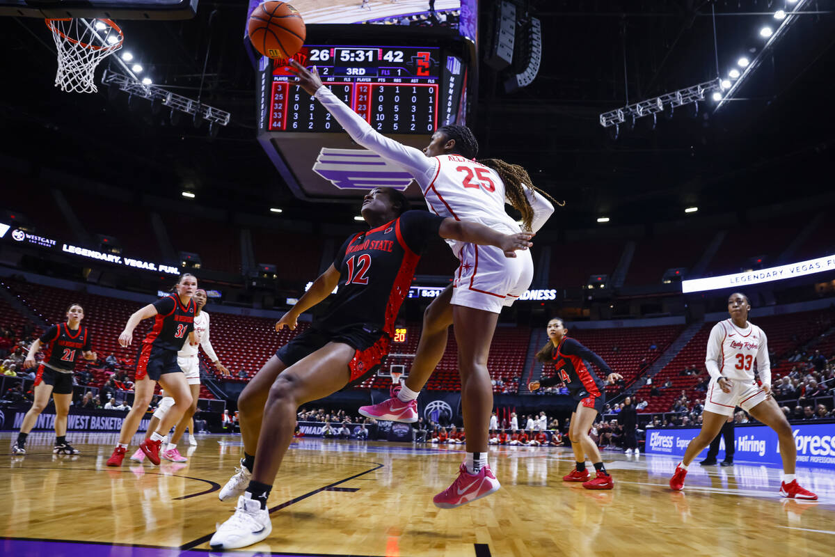 UNLV Lady Rebels guard Aaliyah Alexander (25) tries to keep the ball in against San Diego State ...