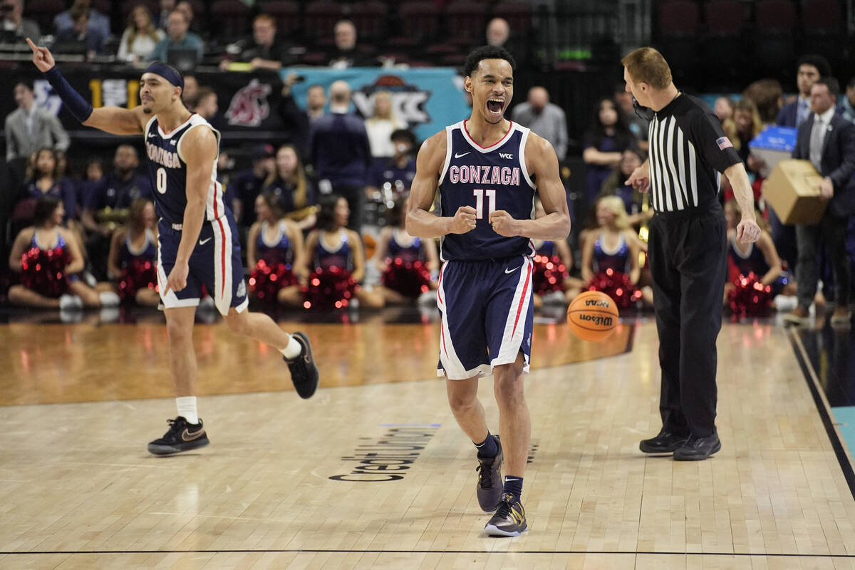 Gonzaga guard Nolan Hickman (11) celebrates after his team defeated Saint Mary's in an NCAA col ...