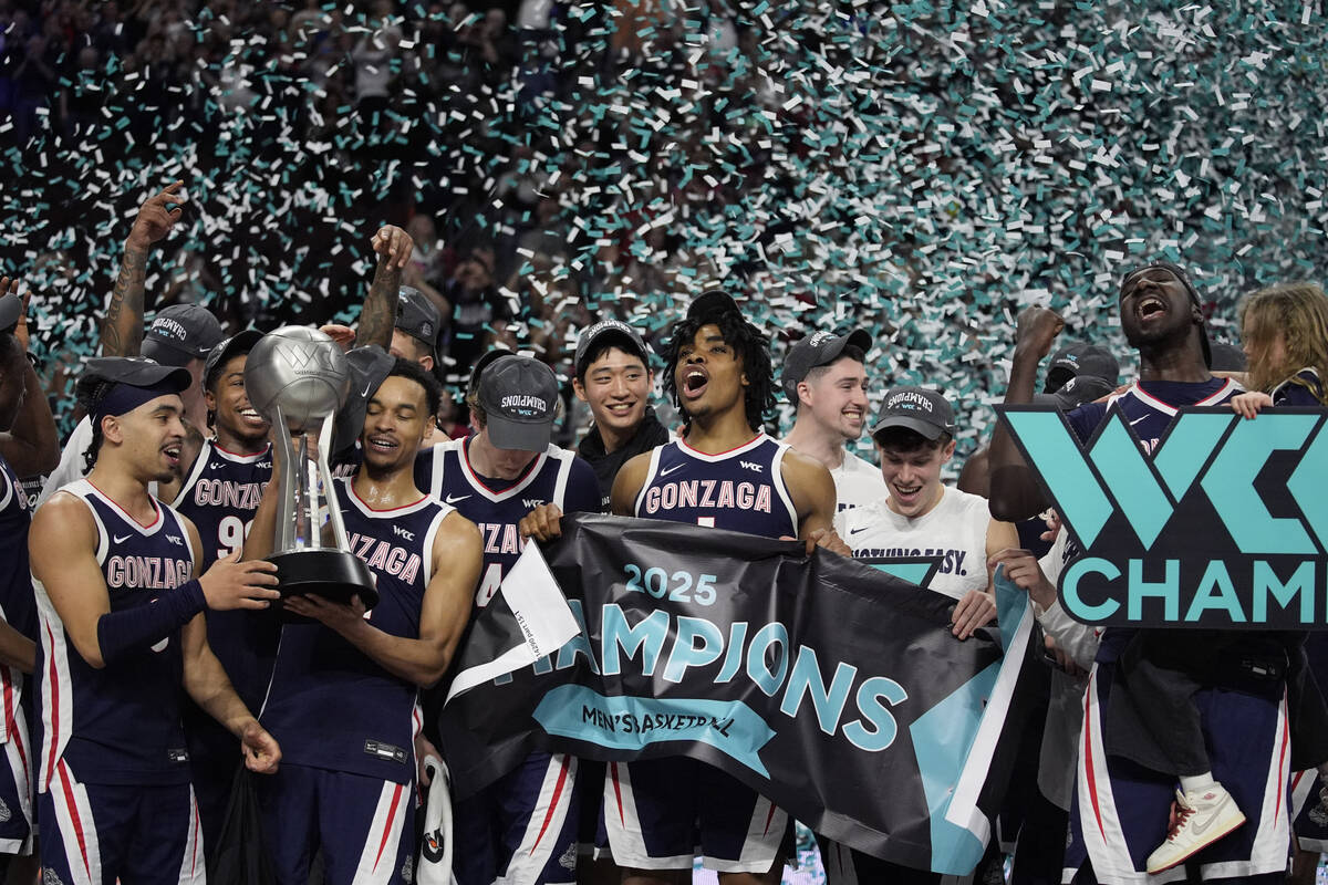 Gonzaga players celebrate after defeating Saint Mary's in an NCAA college basketball championsh ...