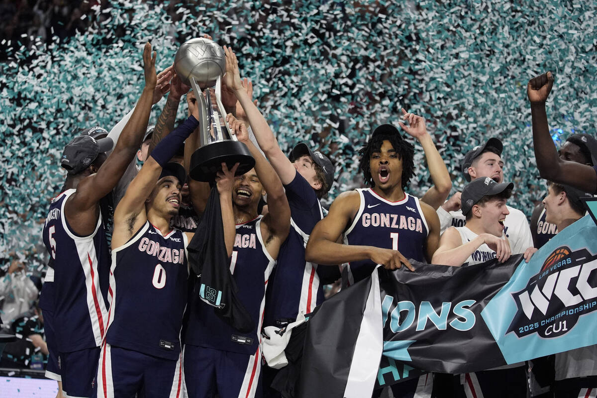 Gonzaga players celebrate after defeating Saint Mary's in an NCAA college basketball championsh ...