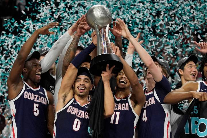 Gonzaga players celebrate after defeating Saint Mary's in an NCAA college basketball championsh ...