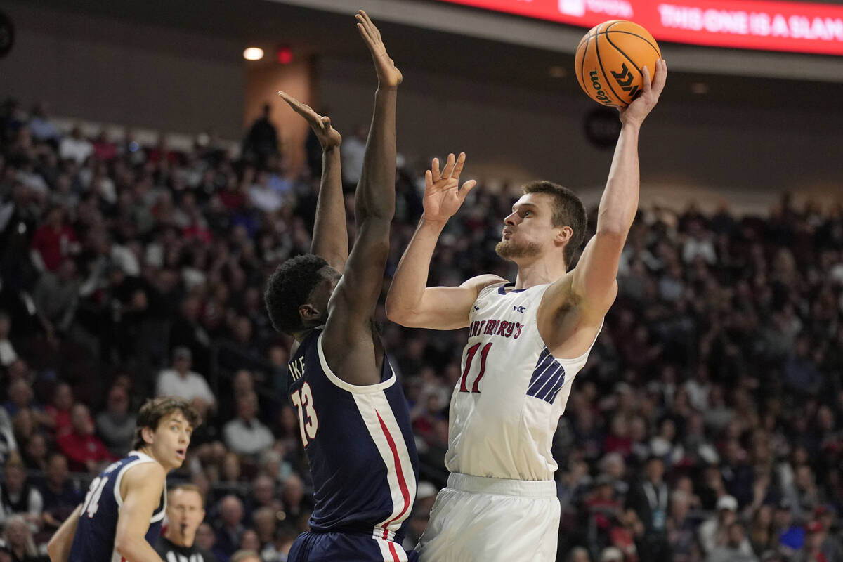 Saint Mary's center Mitchell Saxen (11) shoots over Gonzaga forward Graham Ike (13) during the ...