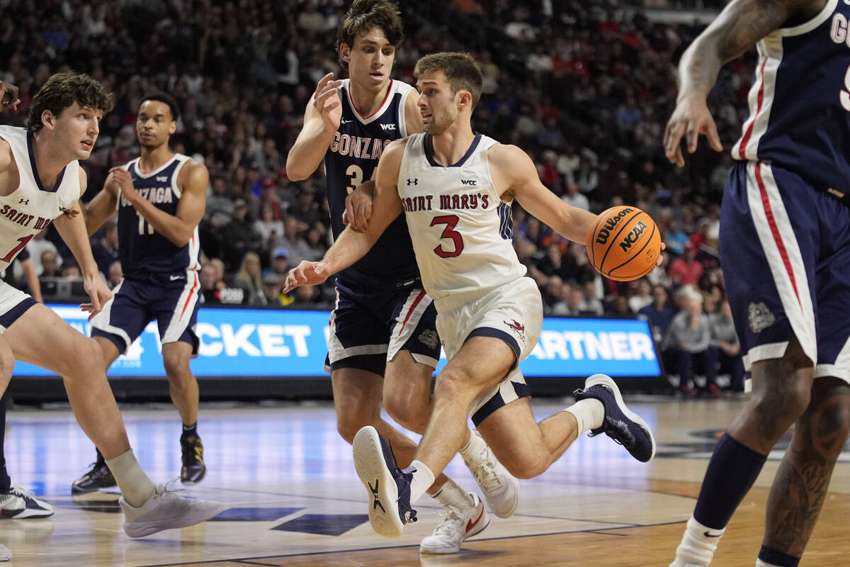 Saint Mary's guard Augustas Marciulionis (3) drives against Gonzaga forward Braden Huff (34) du ...