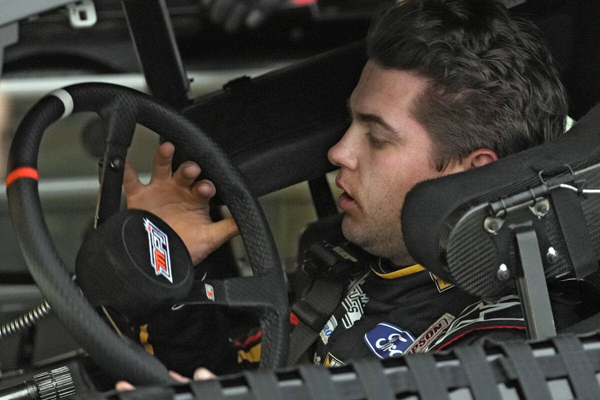 Noah Gragson looks at his steering wheel during a practice for the NASCAR Daytona 500 auto race ...