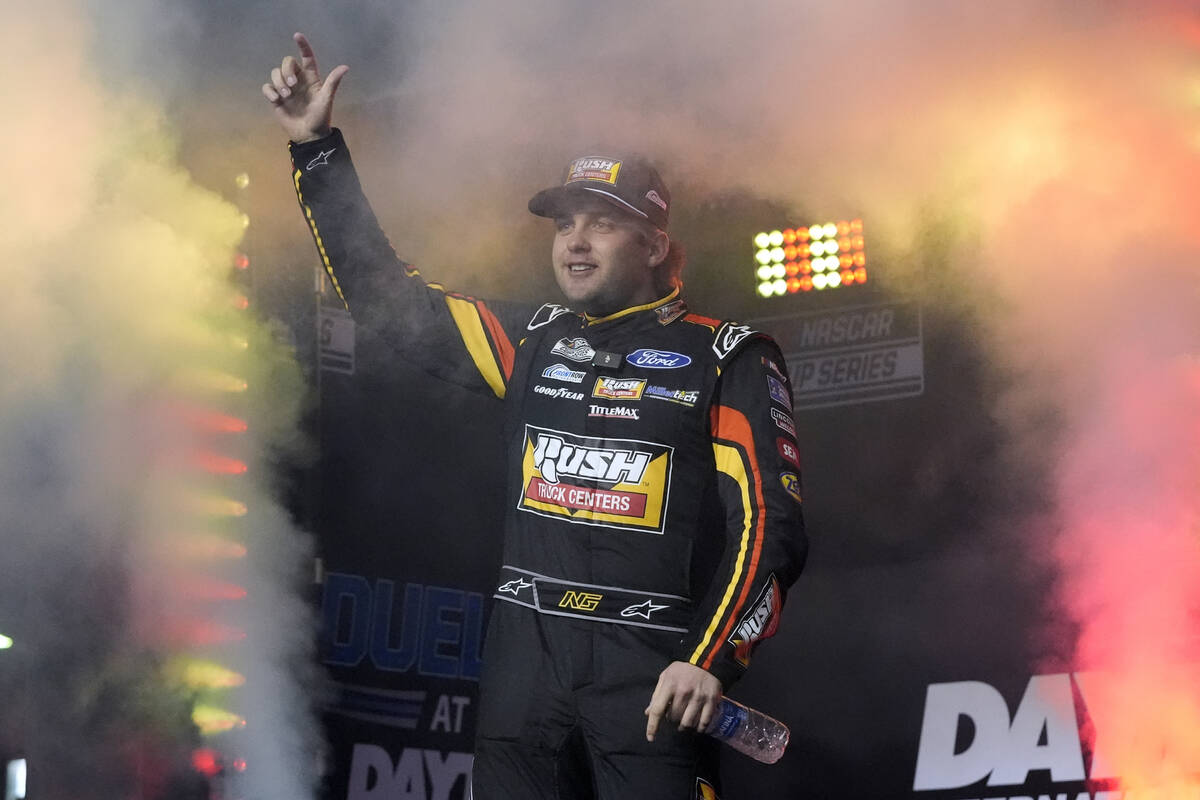 Noah Gragson waves during driver introductions before two NASCAR Daytona 500 qualifying auto ra ...