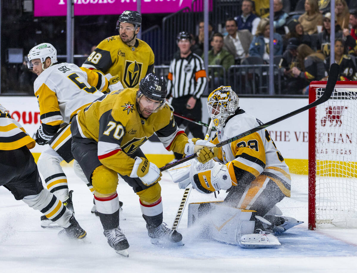 Golden Knights left wing Tanner Pearson (70) kicks up some ice as he changes direction to the p ...