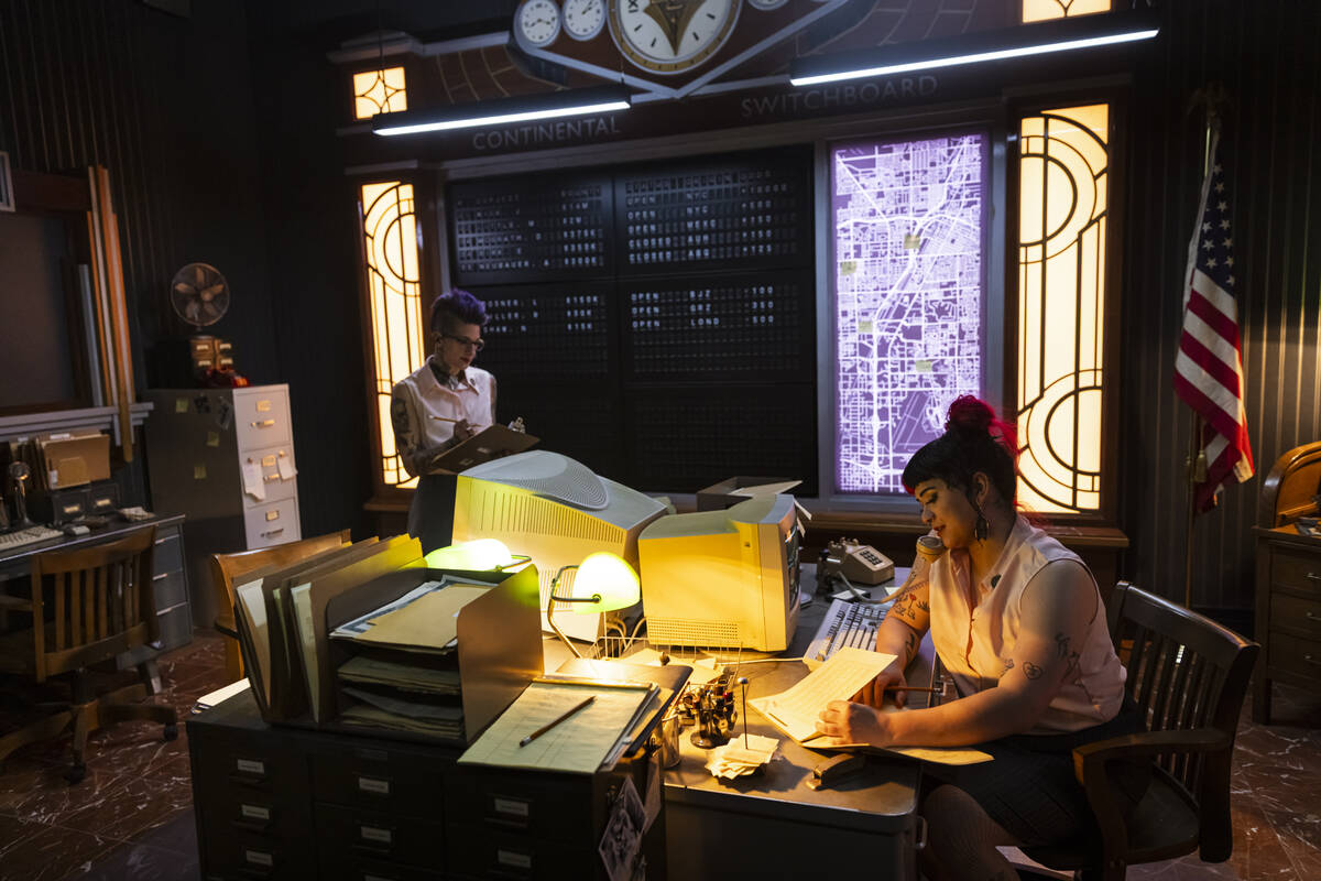 Tii Riga, left, and Karsyn Artemis Love, performers with the John Wick Experience, work in the ...