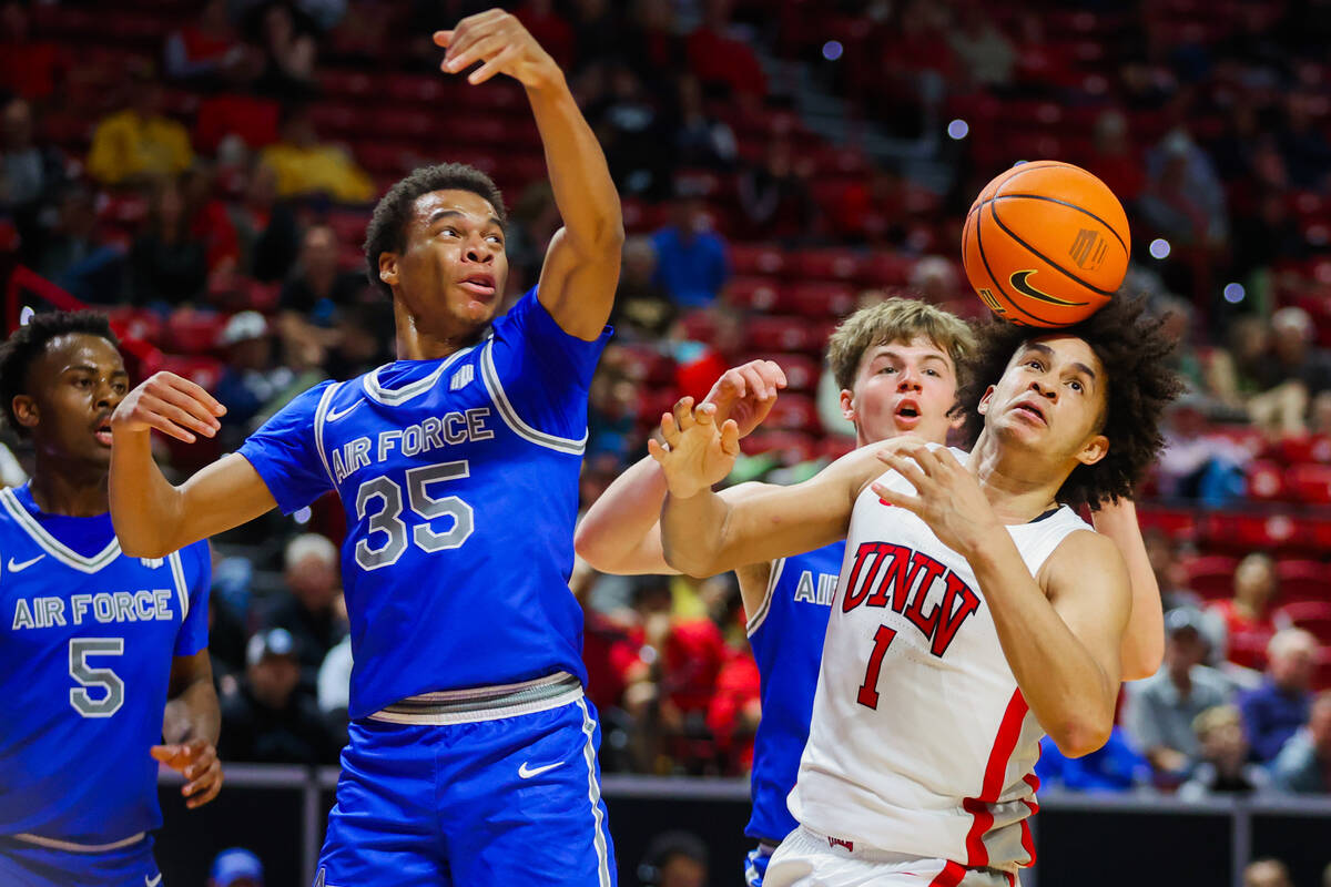 Rebels forward Jalen Hill (1) and Air Force Falcons guard Kyle Marshall (35) reach for possessi ...