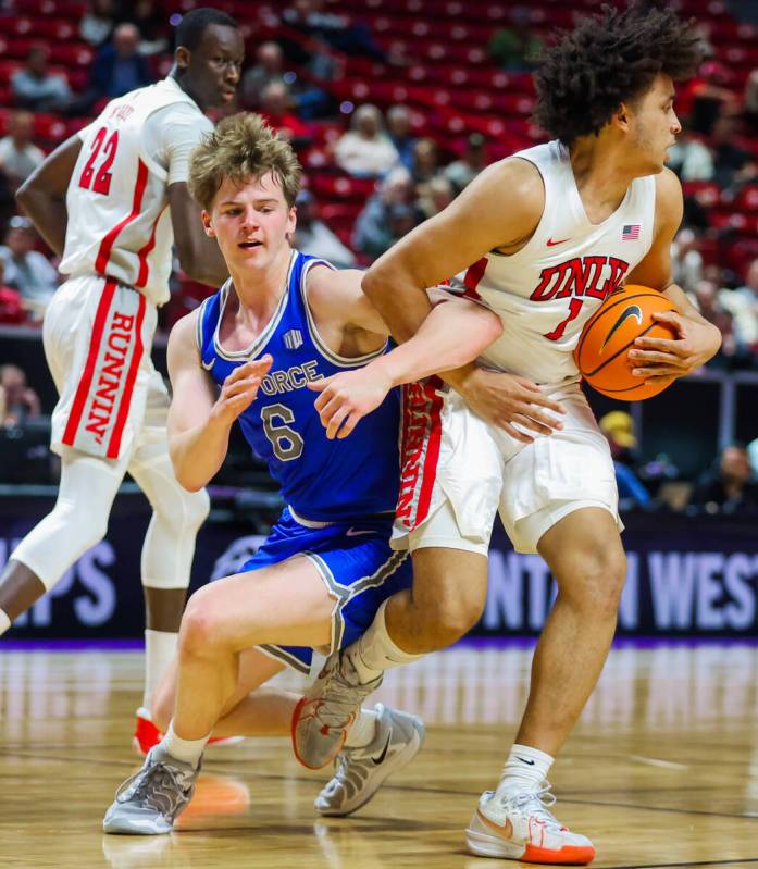 Rebels forward Jalen Hill (1) gets caught up with Air Force Falcons forward Will Cooper (6) whi ...