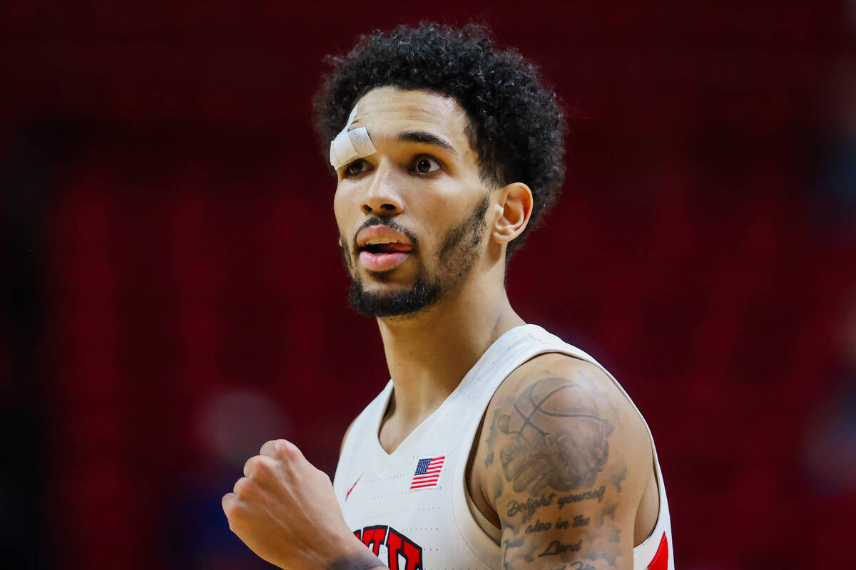 Rebels guard Jailen Bedford reacts to a teammate drawing a foul during a Mountain West men&#x20 ...