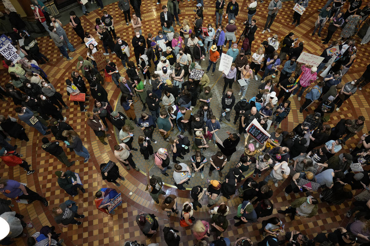 Protesters fill the Iowa state Capitol to denounce a bill that would strip the state civil righ ...