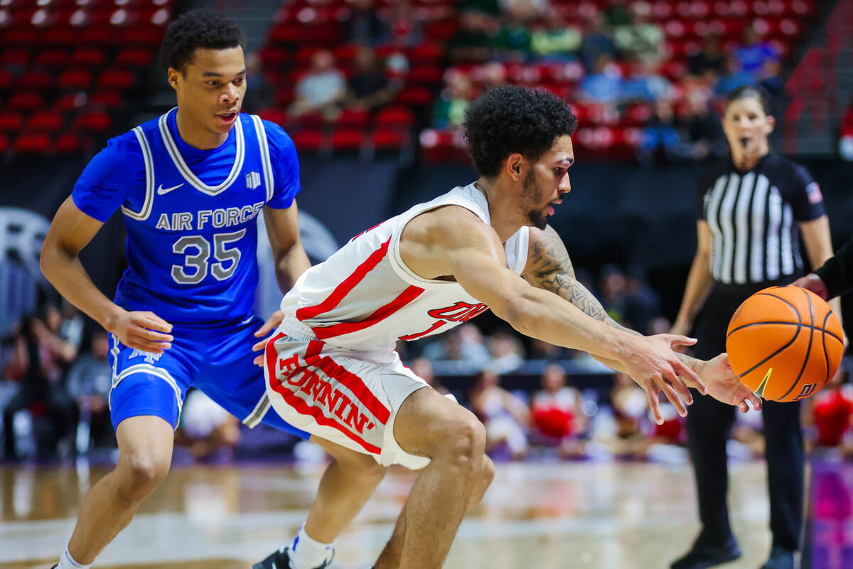 Rebels guard Jailen Bedford (14) loses the ball out of bounds during a Mountain West men&#x2019 ...