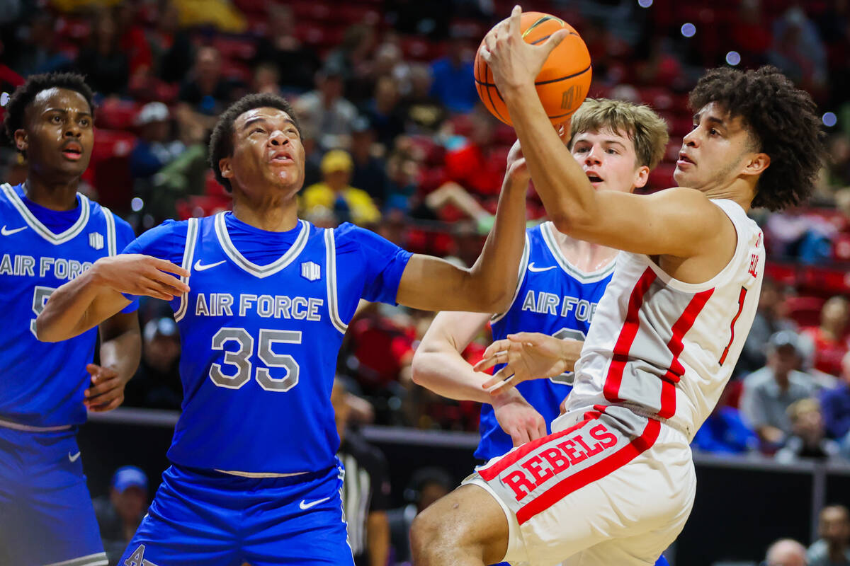Rebels forward Jalen Hill (1) tries to keep the ball in his possession during a Mountain West m ...
