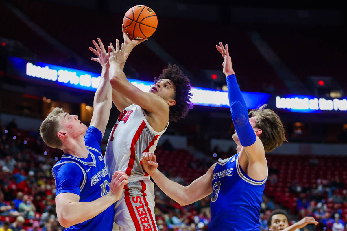 Rebels forward Jalen Hill (1) attempts a basket against Air Force Falcons defense during a Moun ...