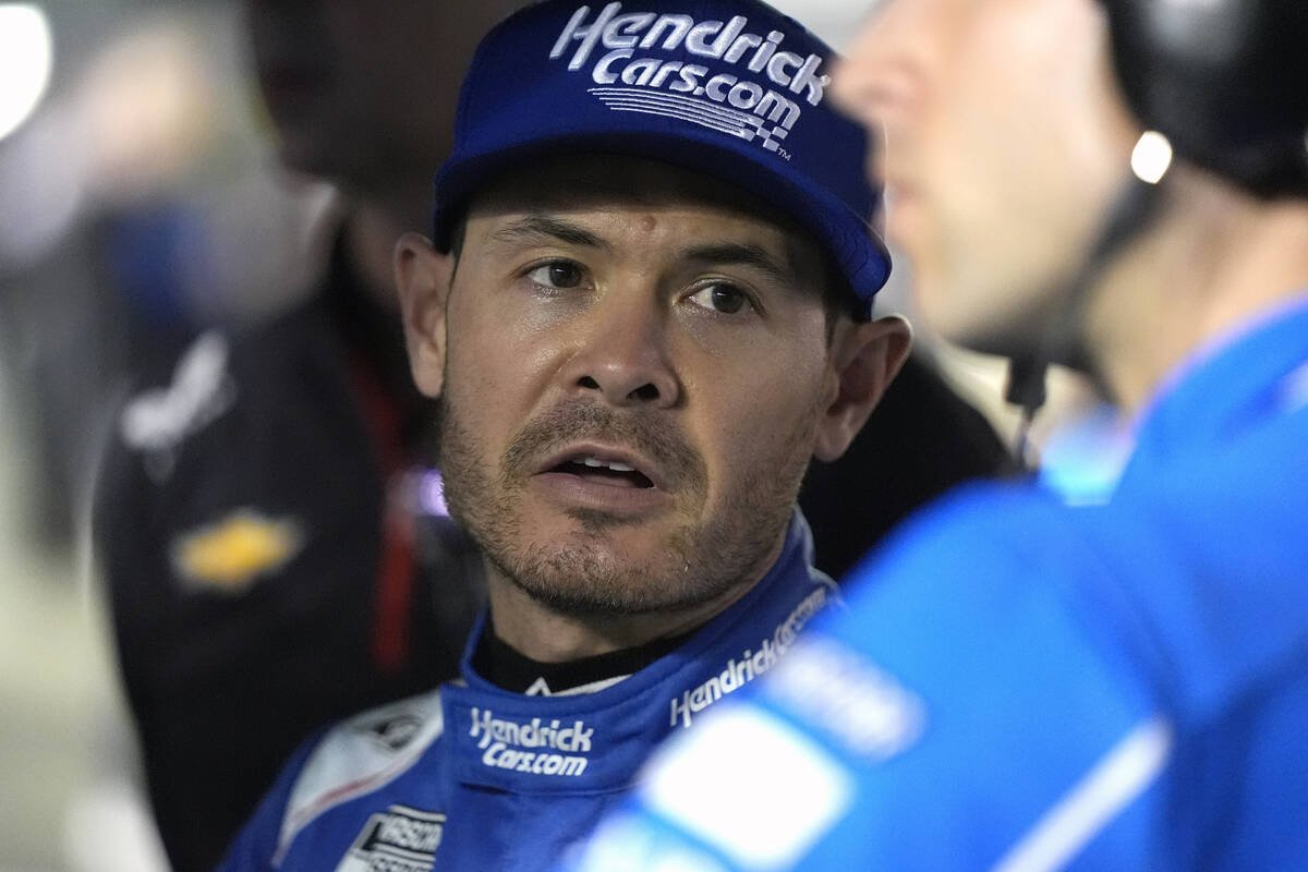 Kyle Larson talks with his crew on pit road during qualifying for the NASCAR Daytona 500 auto r ...