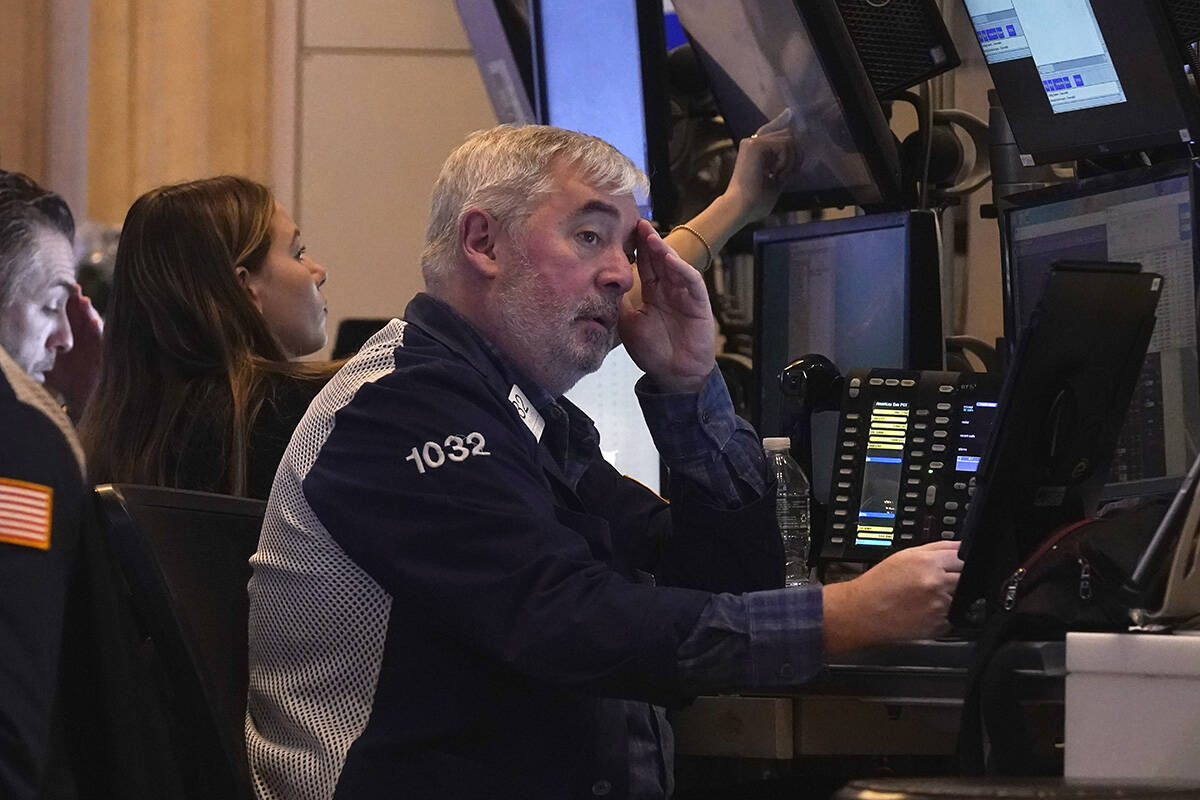 Traders work on the floor of the New York Stock Exchange, Tuesday, March 11, 2025. (AP Photo/Ri ...