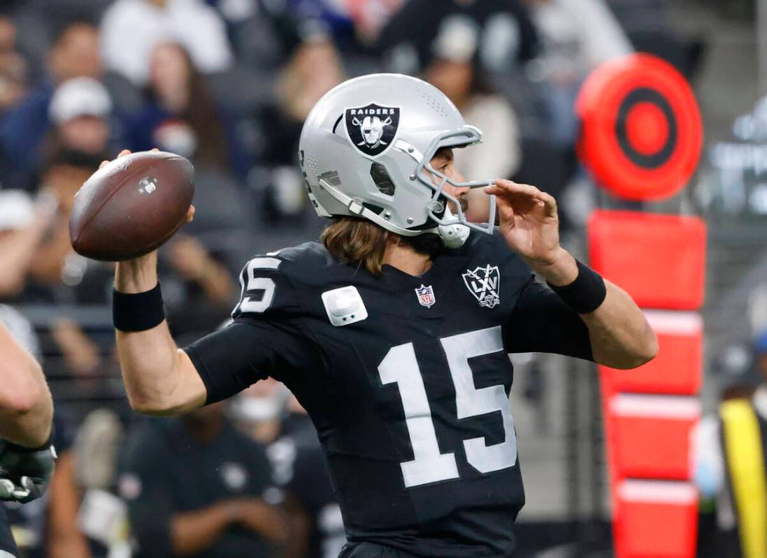 Raiders quarterback Gardner Minshew (15) throws during the first half of an NFL game against th ...