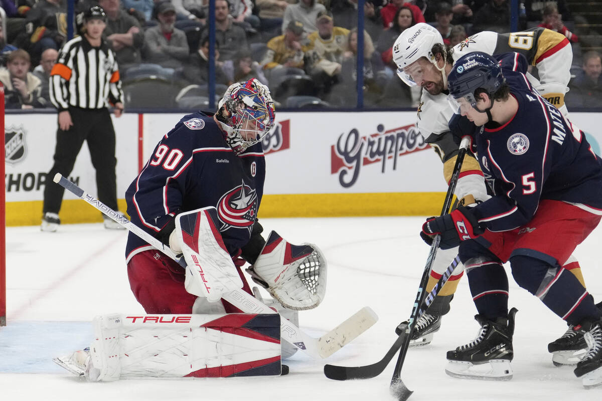 Columbus Blue Jackets goaltender Elvis Merzlikins (90) blocks a shot by Vegas Golden Knights ri ...