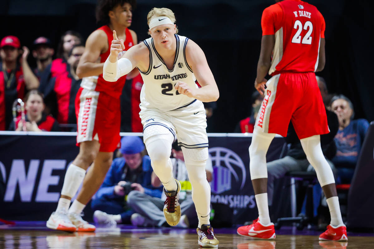 Utah State Aggies forward Karson Templin (22) signals forward during a Mountain West tournament ...