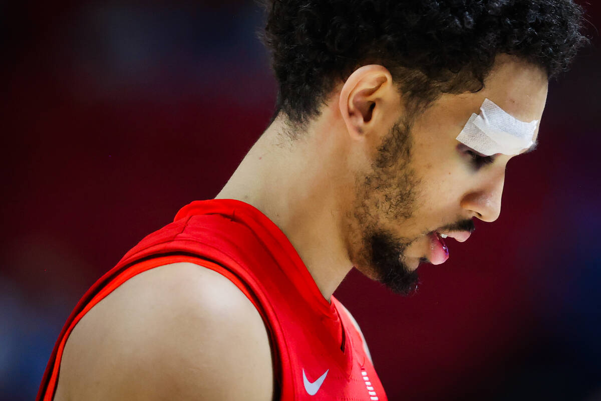 Rebels guard Jailen Bedford looks down during a Mountain West tournament NCAA men’s bask ...