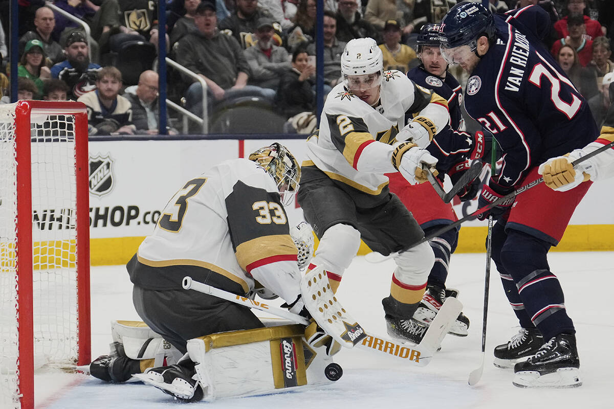 Vegas Golden Knights goaltender Adin Hill (33) blocks a shot by Columbus Blue Jackets left wing ...