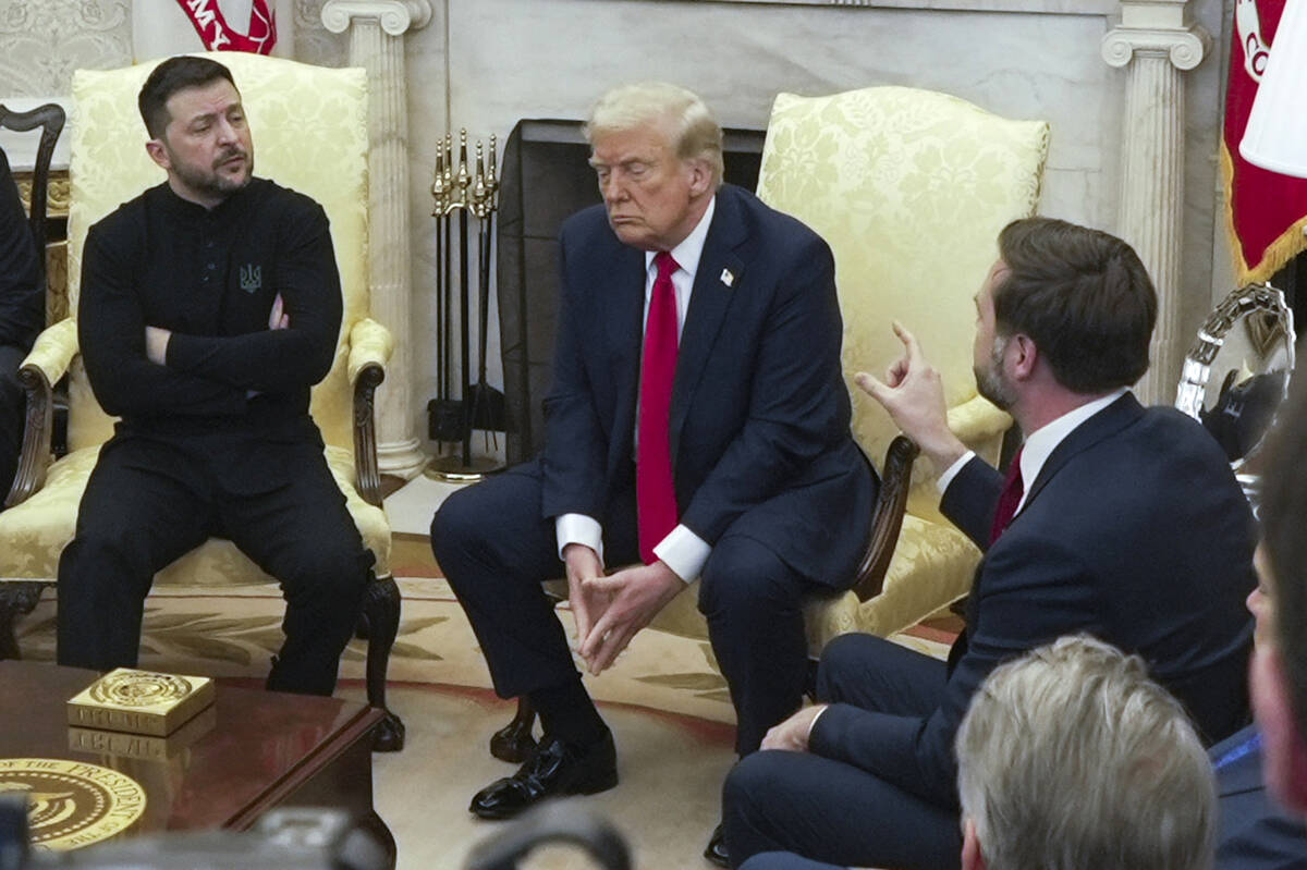 Vice President JD Vance, right, speaks with Ukrainian President Volodymyr Zelenskyy, left, as P ...