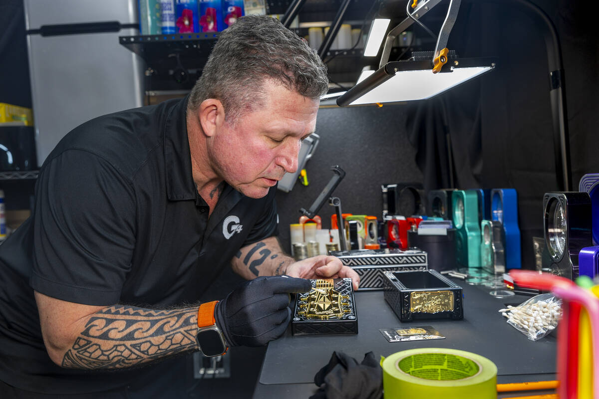 Owner Johneric Stensrud with Gorilla Pro Customs works on a custom box with a Les Paul Guitar f ...