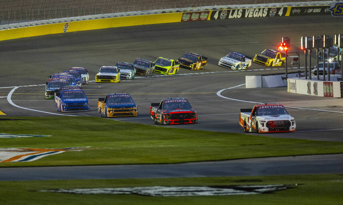 Trucks come into pit row to park as rain begins during the NASCAR Craftsman Truck Series Ecosav ...