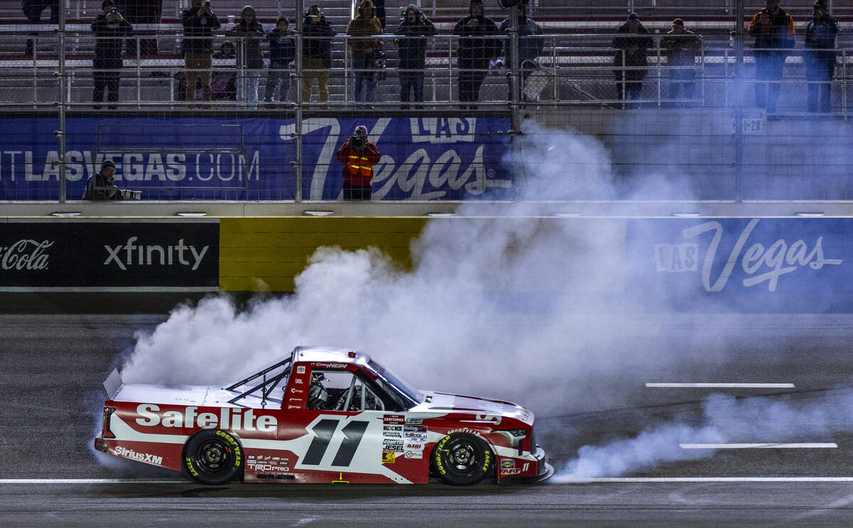 Corey Heim (11) burns his tires at the finish line after he wins the NASCAR Craftsman Truck Ser ...