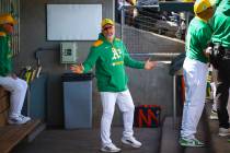 Athletics manager Mark Kotsay talks in the dugout during a Big League Weekend baseball game aga ...