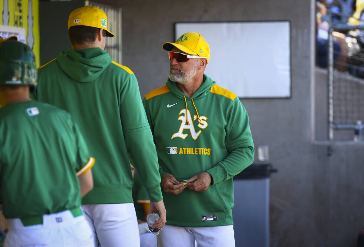 Athletics manager Mark Kotsay talks in the dugout during a Big League Weekend baseball game aga ...