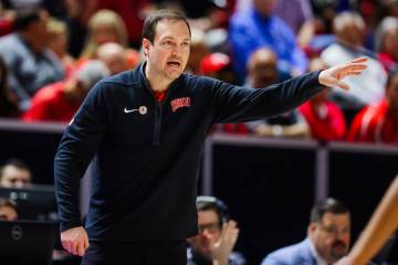 Rebels head coach Kevin Kruger coaches his team during a Mountain West men’s tournament ...