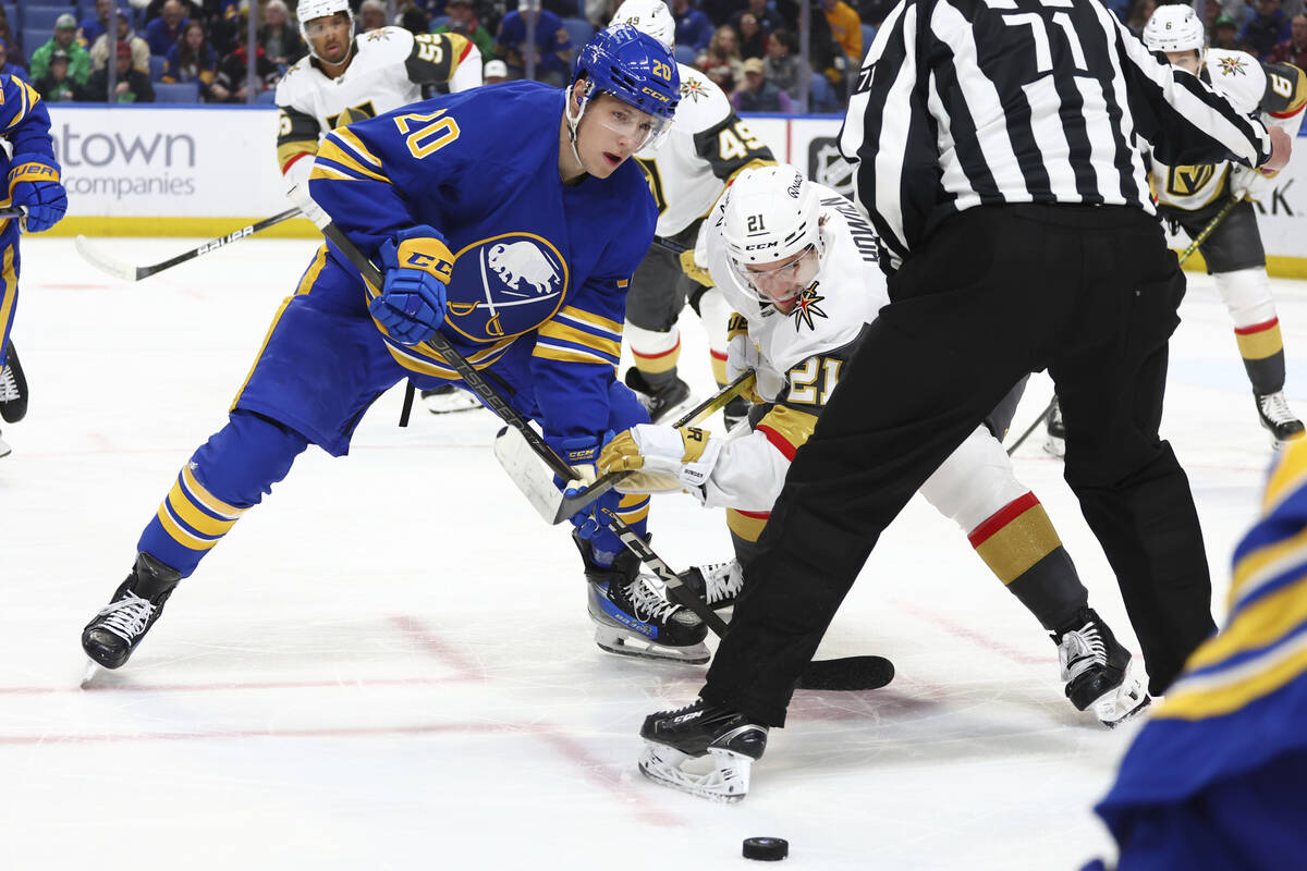 Buffalo Sabres center Jiri Kulich (20) wins a faceoff against Vegas Golden Knights center Brett ...
