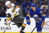 Vegas Golden Knights center Jack Eichel (9) and Buffalo Sabres defenseman Connor Clifton (75) c ...