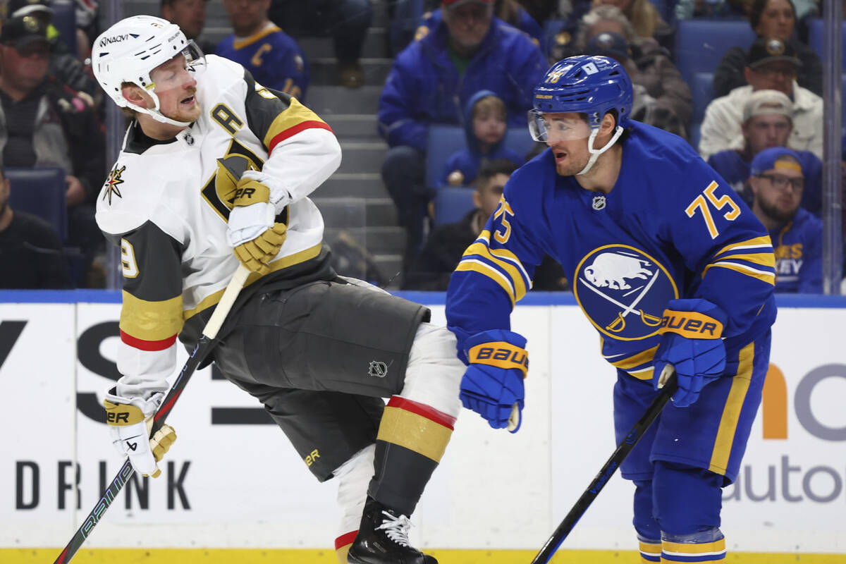 Vegas Golden Knights center Jack Eichel (9) and Buffalo Sabres defenseman Connor Clifton (75) c ...