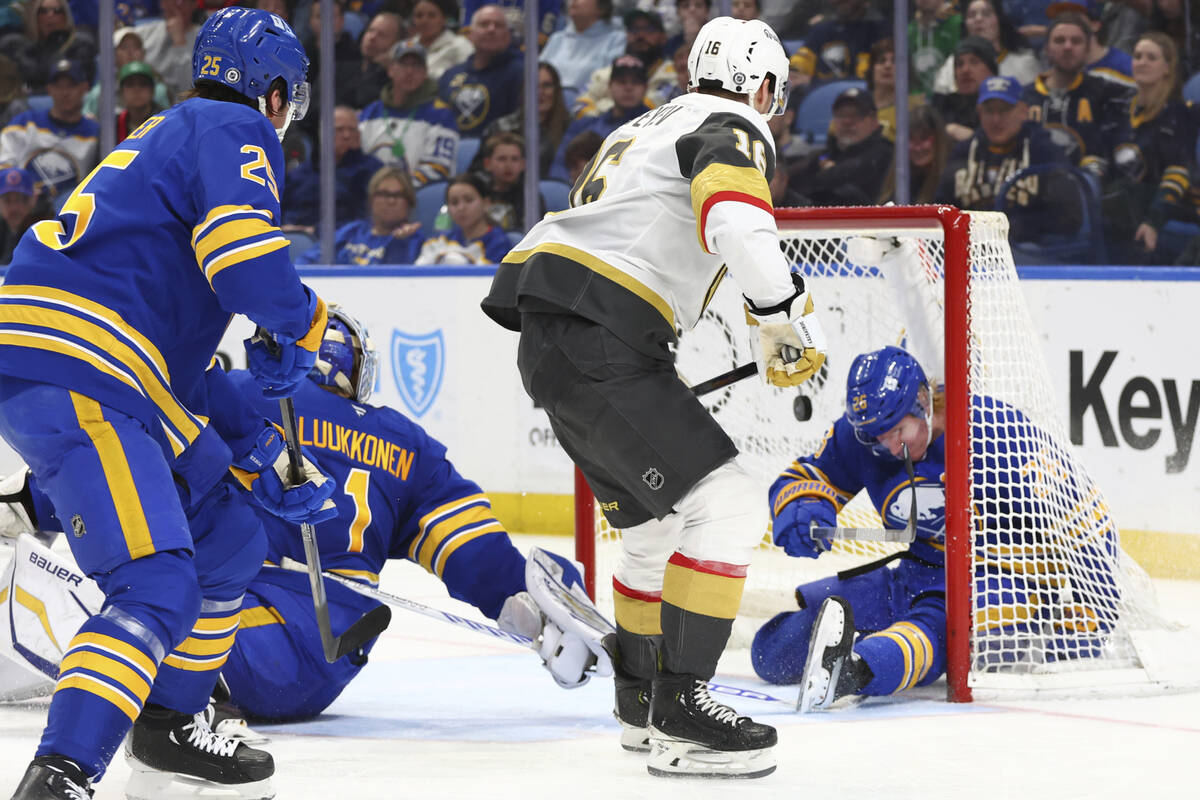 Vegas Golden Knights left wing Pavel Dorofeyev (16) puts the puck past Buffalo Sabres goaltende ...