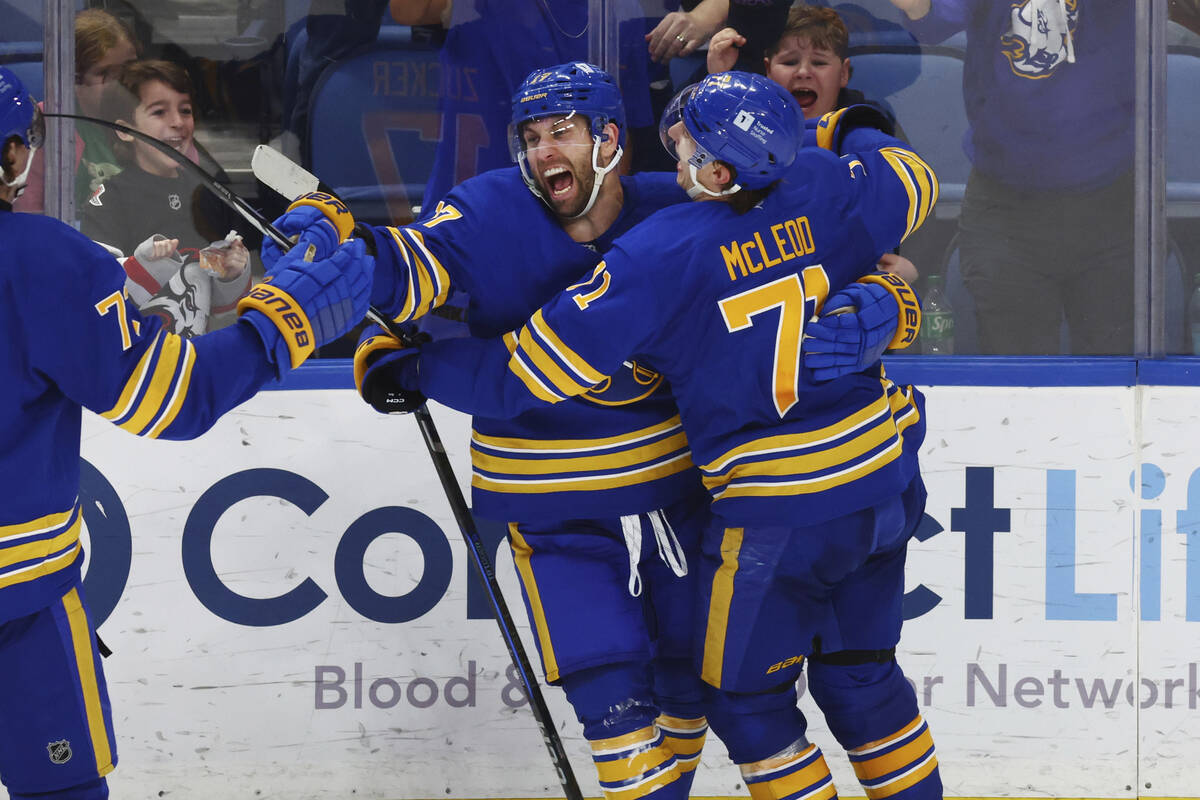 Buffalo Sabres left wing Jason Zucker (17) celebrates his goal with center Ryan McLeod (71) dur ...