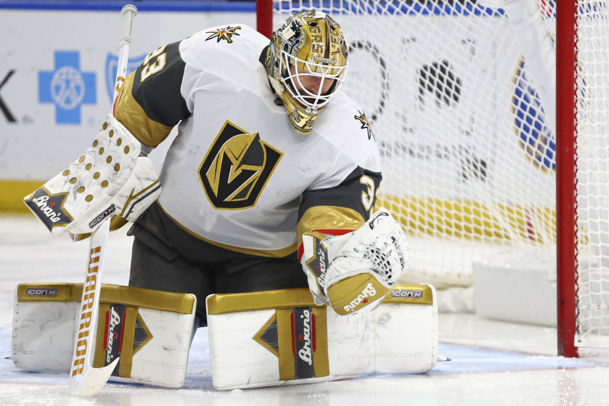 Vegas Golden Knights goaltender Adin Hill (33) makes a glove save during the first period of an ...