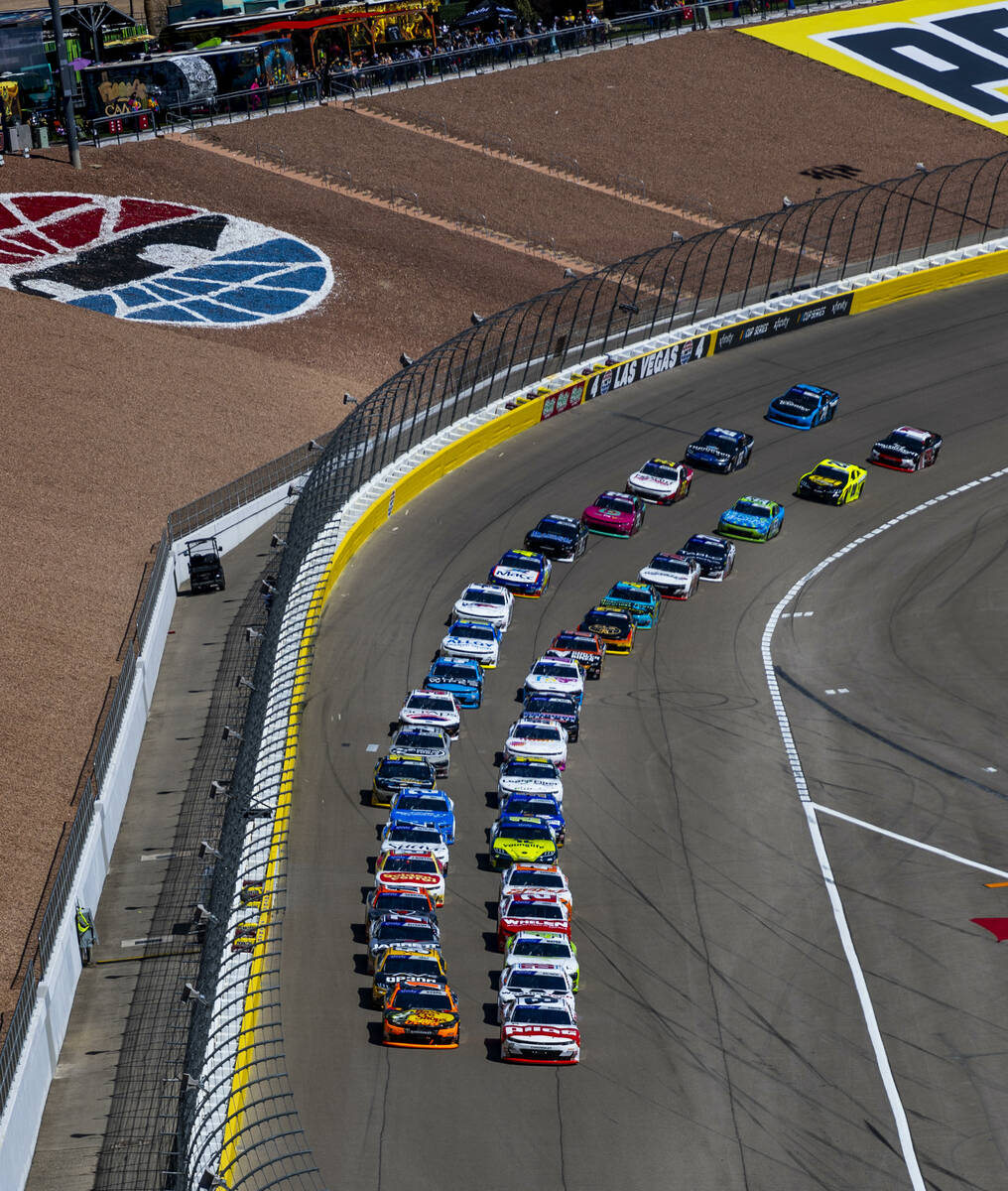 Cars approach the start line to begin The LiUNA NASCAR Xfinity Series race at Las Vegas Motor S ...