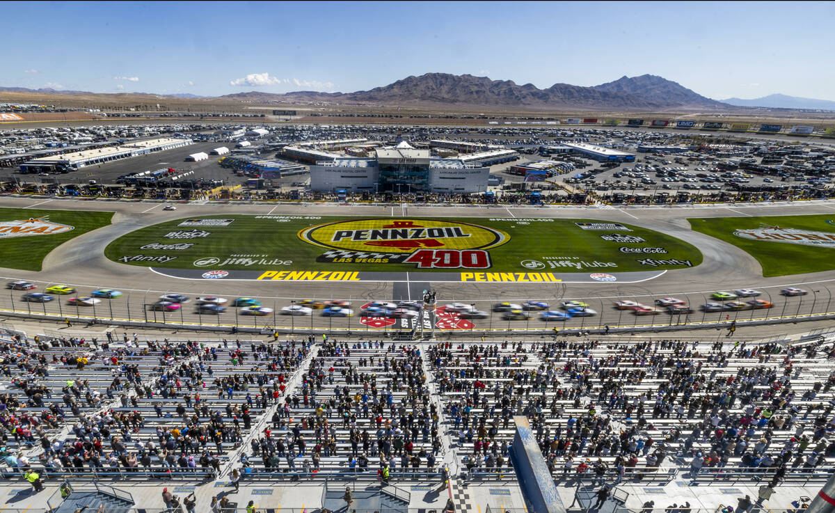 Cars move about the start line to begin The LiUNA NASCAR Xfinity Series race at Las Vegas Motor ...