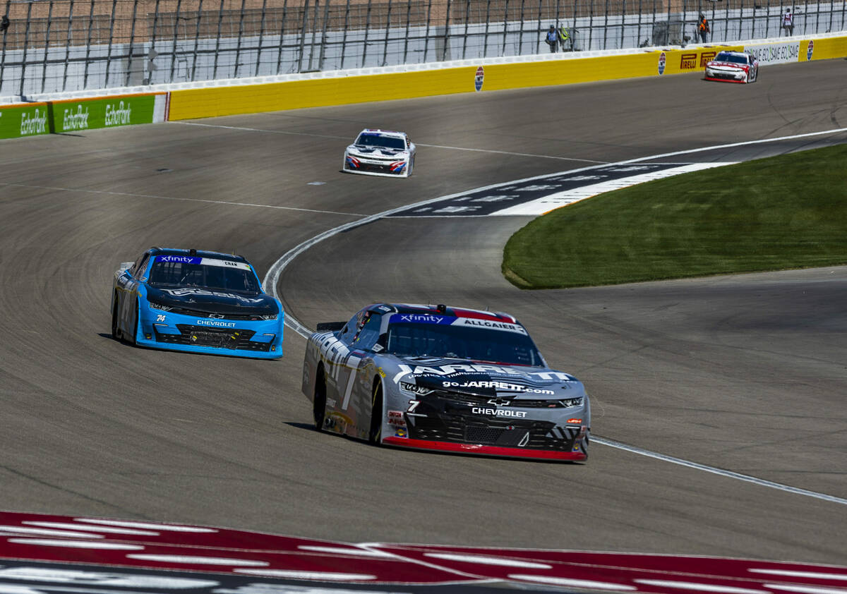 Driver Justin Allgaier (7) navigates out of turn 4 ahead of Dawson Cram (74) during The LiUNA N ...
