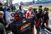 The pit crew for Justin Allgaier (7) douses each other with water after he crosses the finish l ...
